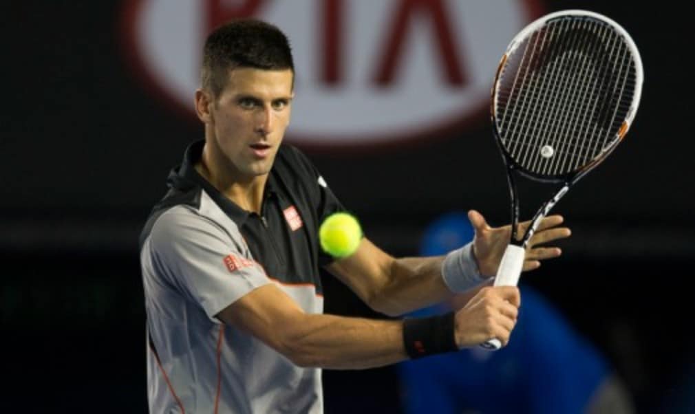 Novak Djokovic beat Denis Istomin in straight sets under the Rod Laver Arena roof to make the Australian Open fourth round