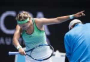 Victoria Azarenka celebrates reaching the Australian Open third round after a 6-1 6-2 victory over Danka Kovinic