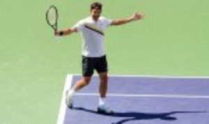 Roger Federer displayed his battling qualities as he recovered from a precarious position to defeat Borna Coric 5-7 6-4 6-4 and reach an eighth final at the BNP Paribas Open