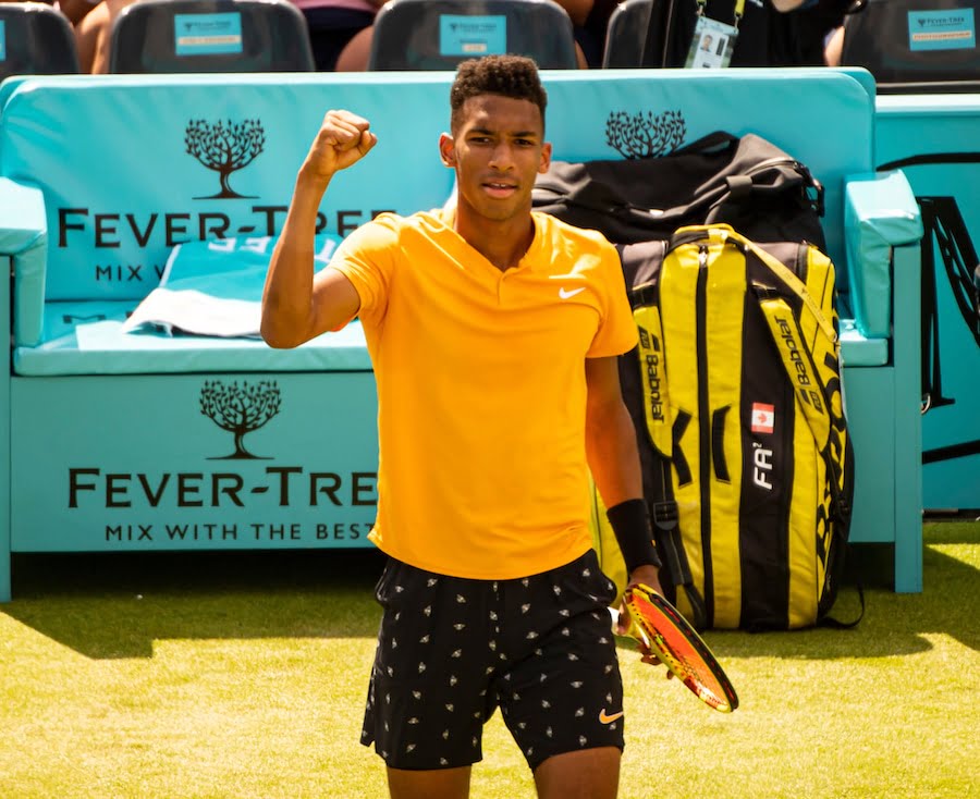 Felix Auger-Aliassime plays on grass at Queens Club