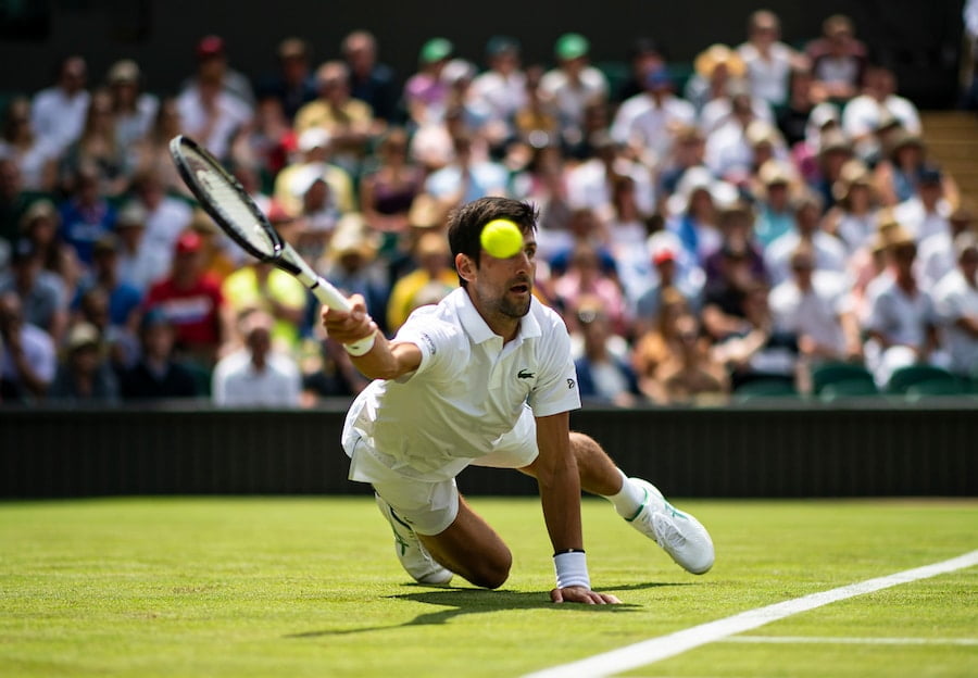 Novak Djokovic Wimbledon 2019 diving for shot