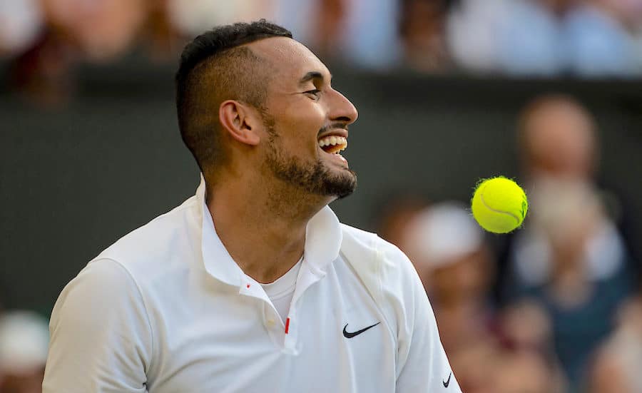 Nick Kyrgios laughs