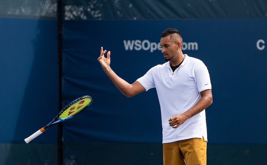 Nick Kyrgios throws racket