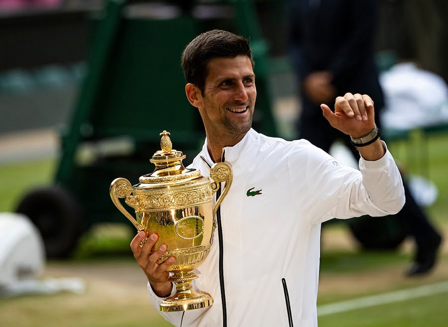 Novak Djokovic Wimbledon trophy after beating Roger Federer