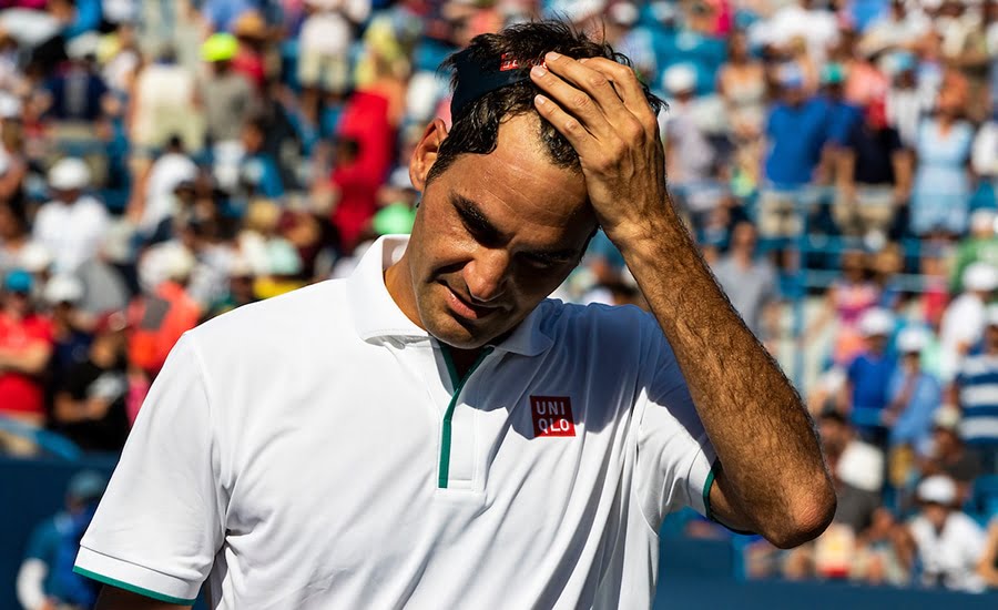Roger Federer holding head