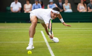Milos Raonic stretches Wimbledon 2019.jpg