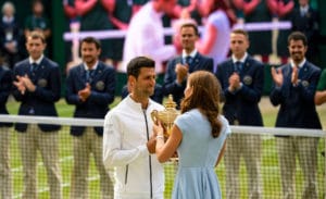 Novak Djokovic accepts Wimbledon 2019 trophy from Duchess of Cambridge.jpg
