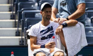 Novak Djokovic receiving treatment