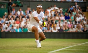 Rafa Nadal plays backhand at Wimbledon 2019.jpg