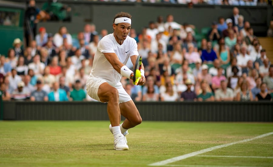 Rafa Nadal plays backhand at Wimbledon 2019.jpg