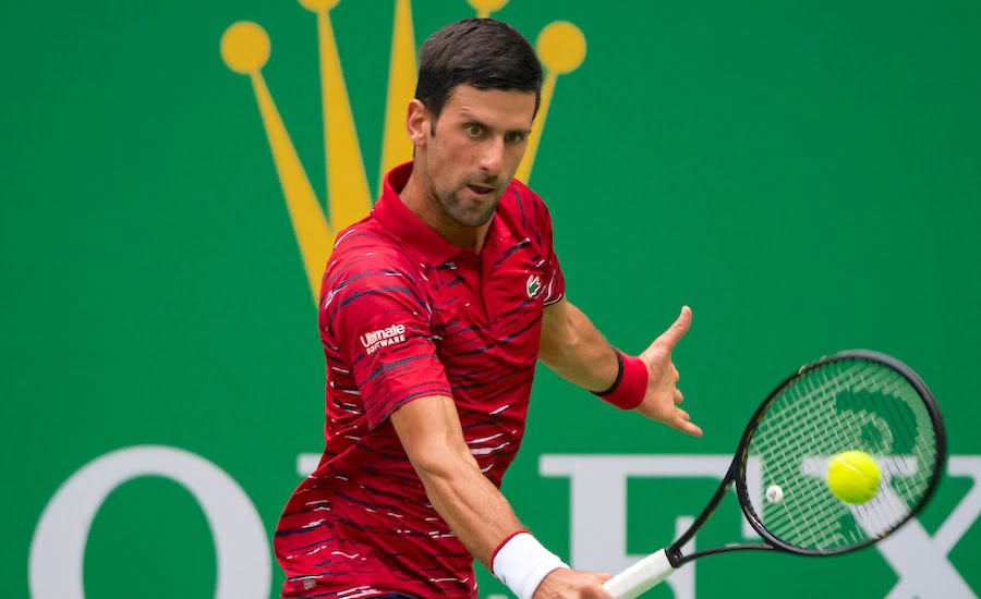 Novak Djokovic plays a backhand at the Shanghai Masters 2019