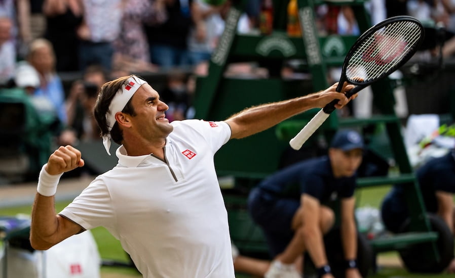 Roger Federer punches air in delight at Wimbledon 2019