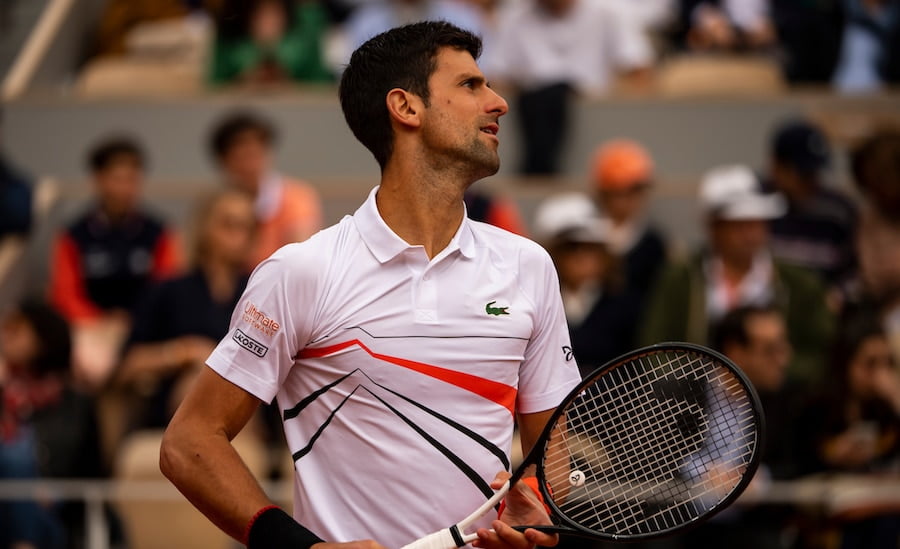 Novak Djokovic prepares to hit at Roland Garros 2019