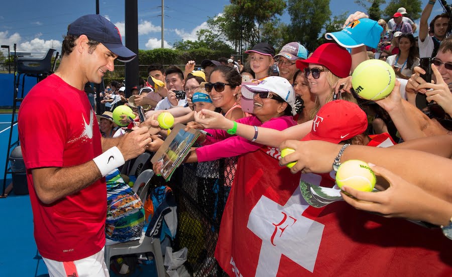 Roger Federer signs autographs
