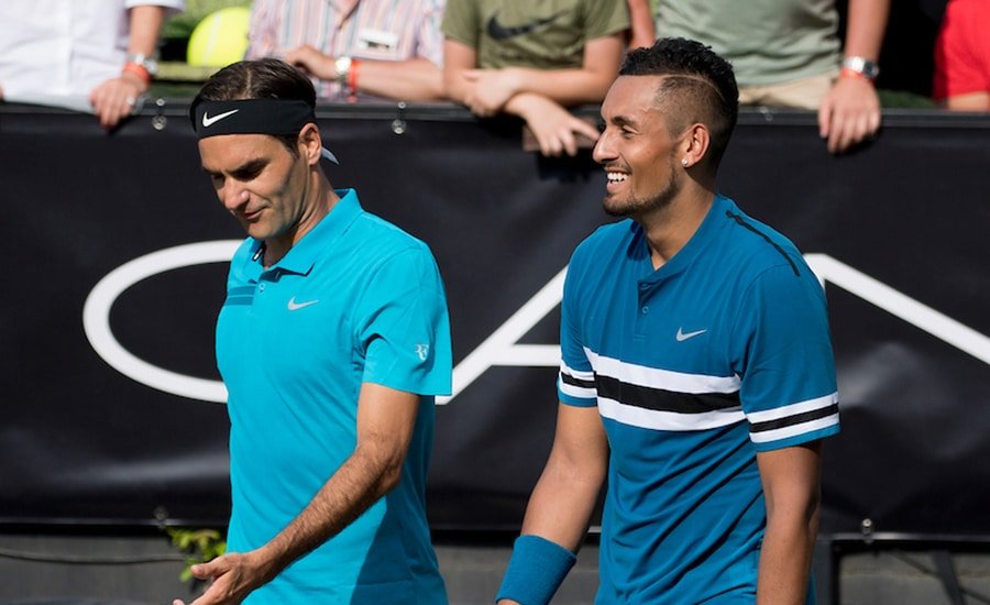 Nick Kyrgios and Roger Federer in discussion