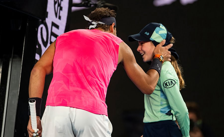 Rafael Nadal with ballgirl after hitting her