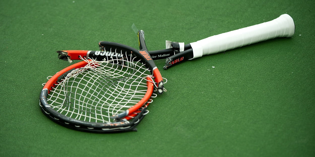 smashed tennis racket