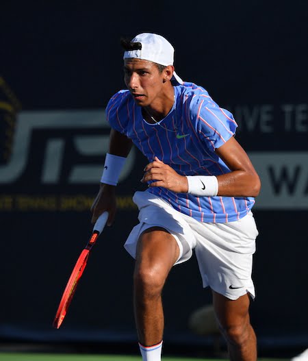 Alexei Popyrin runs for a ball