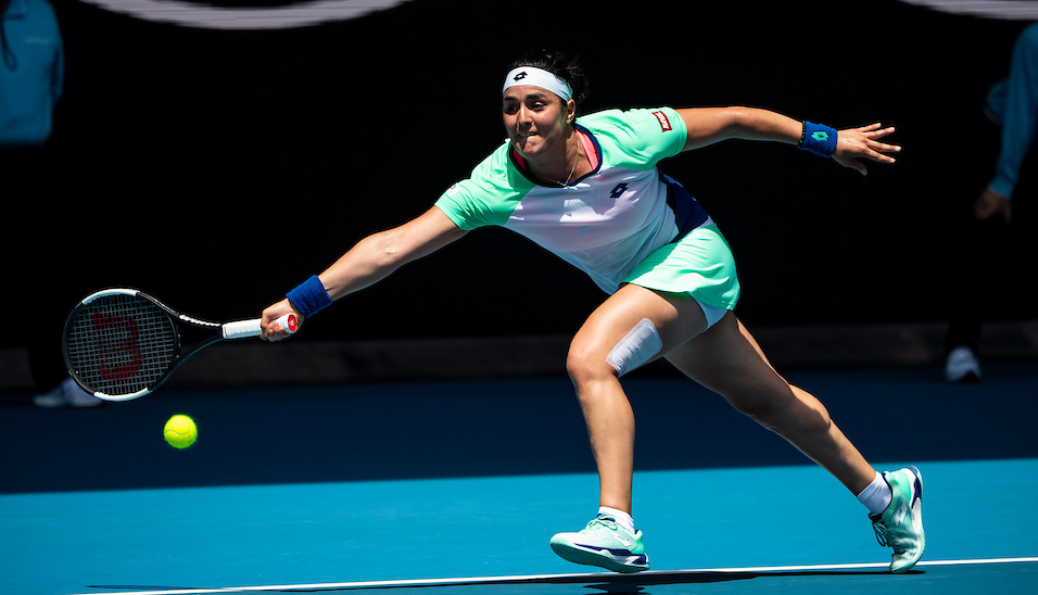 Ons Jabeur stretches for a forehand at the Australian Open 2020