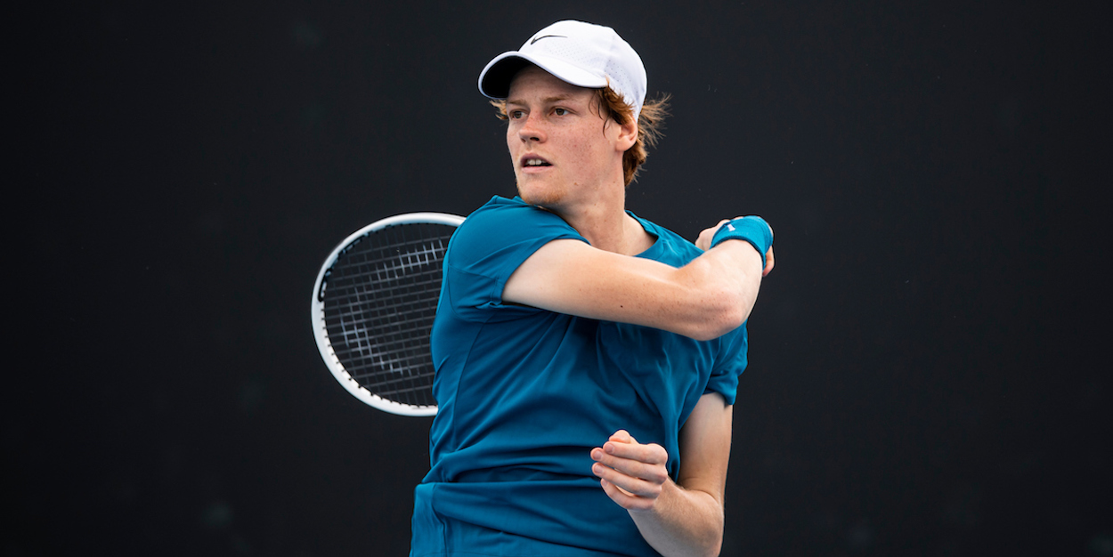 Jannik Sinner of Italy plays a forehand in his quarter final match