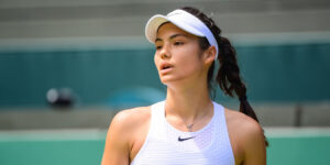 Emma Raducanu looks on at Wimbledon