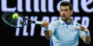 Novak Djokovic hits tennis ball Australian Open 2024